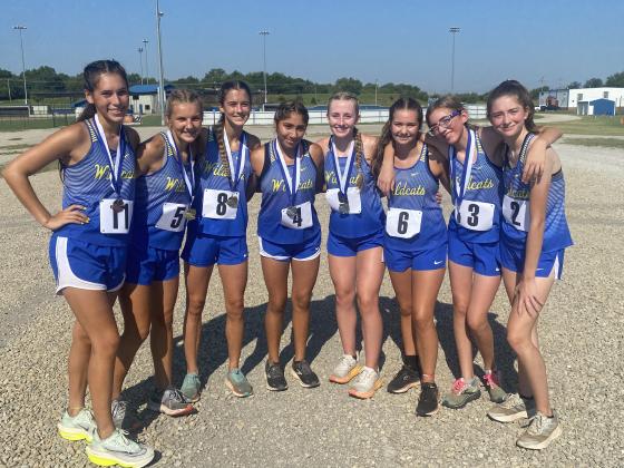 Bethel's cross country girls pose following the Stroud Cross Country Meet on Aug. 13. Baylee Tapley (#8) placed first in the one-mile race with a 6:01.75, and Kylie Nunneley (#5) came in second. Grace Epperley (#4) placed seventh; Shyla Arnold (#3) placed ninth; and Bella Thomas (#9) placed 10th. Also shown, from left, are Brylan Webb (#11), Paityn Seiger (#6), and Lilly Arnold (#2). Not shown is Piper Whitecotton. Photo provided by Coach Taylor Opskar.