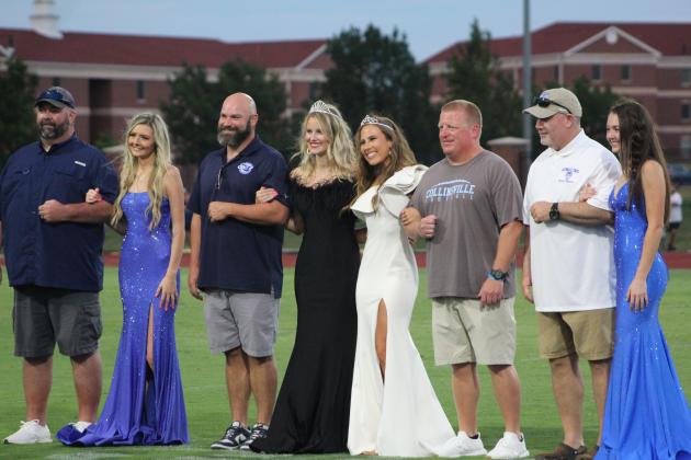 The All-State Football Queen, Olivia McGuire (in black) of Velma-Alma, runner-up Kate Tuttle of Collinsville, and candidates Dara Hunt of Marlow, far left, and Meghan Roberts of Ringling, far right, pose at halftime.