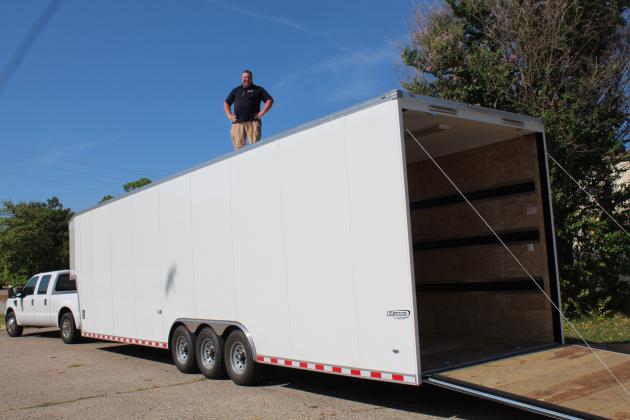 Tecumseh Band Director John Outon stands atop the new band trailer, where he will direct the band.