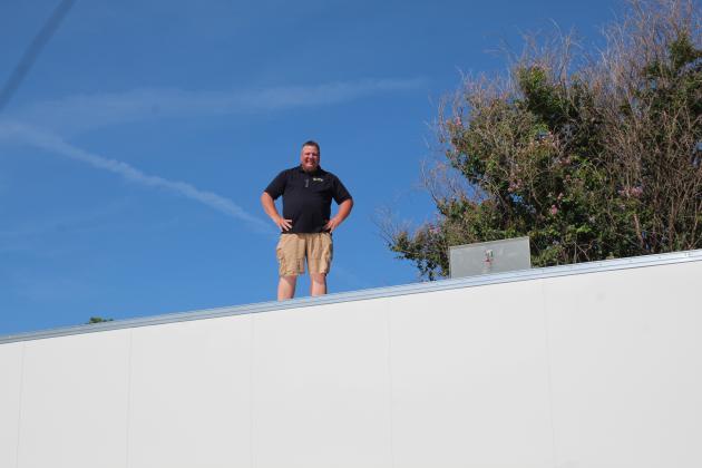 Tecumseh Band Director John Outon stands atop the new band trailer, where he will direct the band.