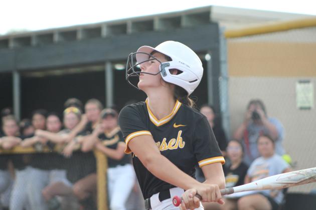 Tecumseh's Emily Gage sends the ball flying during the second inning of the game against Blanchard on Aug. 8. The first Tecumseh fastpitch home game of the season took a break for lightning after the second inning and was eventually rained out. Countywide &amp; Sun/Natasha Dunagan