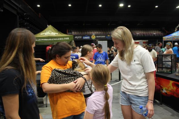 Volunteer Kylee Richey holds Sheila the 10-month-old kangaroo joey for everyone to pet.