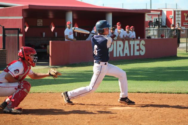 Asher sophomore Kelby Fowler sends the ball flying during the third inning of the game at Dale last Thursday.