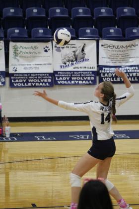 Shawnee's Emerson Thomas serves the ball during the match against North Rock Creek on Sept. 19. The NRC Cougars won 3-0. Countywide &amp; Sun/Natasha Dunagan