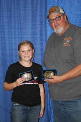 Berklee Gossen, of North Rock Creek FFA, poses with Pottawatomie County Free Fair Board Member Tim Underwood and. her two belt buckles for Reserve Grand Champion Ewe and Grand Champion (Meat Goat) Doe during the Fair Awards on Sept. 10. Gossen also won Senior Showmanship in Meat Goats and Sheep, as well as the Ann "Sis" Gilbert Memorial Award. Countywide &amp; Sun/Natasha Dunagan