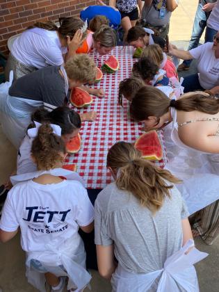 Several people participated in the Frontier Days Watermelon Eating Contest, which was moved in front of Tecumseh City Hall, on Sept. 17. Photo provided.