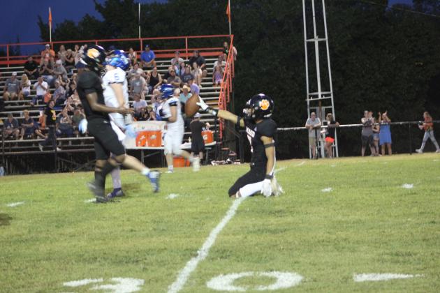 Maud senior Braxton Street holds up the ball for fellow senior Vcake Wassana after intercepting a Depew pass during the home game on Aug. 26. Maud won 52-6. Countywide &amp; Sun/Natasha Dunagan