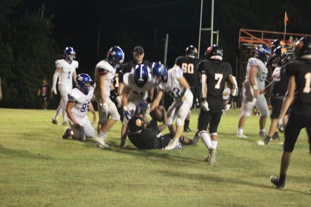 Two players from Depew show good sportsmanship by helping Maud's Vcake Wassana up after he was tackled during the game on Aug. 26. Countywide &amp; Sun/Natasha Dunagan