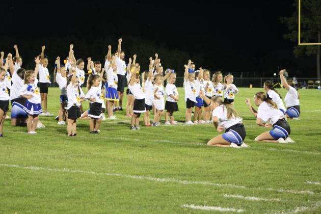 The Pre-K through second-grade girls from the week-long "Little Miss" Wild Kitty Cheerleading Clinic perform during halftime of the Bethel Football Little League Night on Sept. 2. They were led by Bethel Cheerleaders Rumour Prewett, Emma Epperley, Casey Brock, Mallie Broxterman, Alyvia Arnold, Riley Bowie, Chloe Epperley, Reese Nowlin and Shianna Harrison.