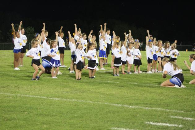 The Little Miss Wild Kitty cheerleaders perform.