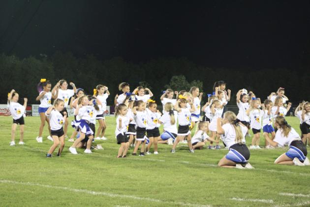 The Little Miss Wild Kitty cheerleaders perform.