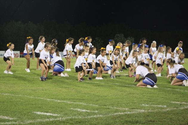 The Little Miss Wild Kitty cheerleaders perform.