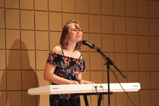Miss Frontier Days contestant Chloe Dawson sings and plays an original song called "A Small Town" during the Frontier Days Pageant on Sept. 11, held at the Tecumseh City Hall Auditorium. Countywide &amp; Sun/Natasha Dunagan