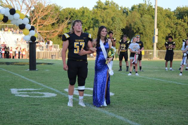 Tecumseh Freshman Attendant Isabella Duggan is escorted by senior Brody Moody during the THS Football Homecoming on Sept. 16. Countywide &amp; Sun/Natasha Dunagan