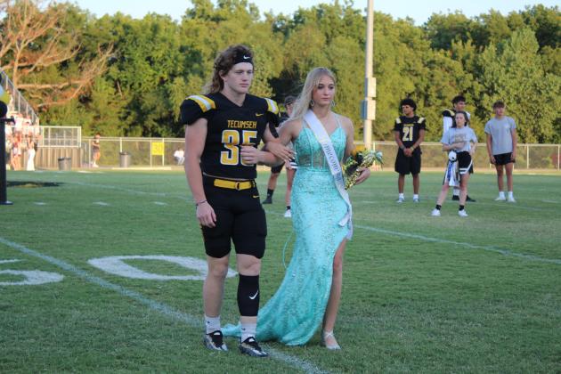 Tecumseh Sophomore Attendant Kallie Kinslow is escorted by senior Conner Barksdale during the THS Football Homecoming on Sept. 16. Countywide &amp; Sun/Natasha Dunagan