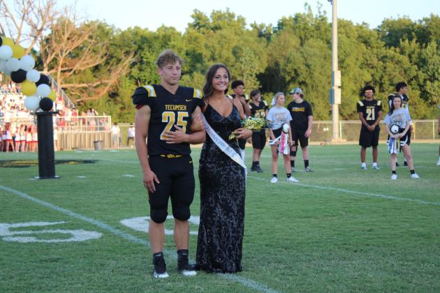 Tecumseh Homecoming Queen Candidate Taylor Gage is escorted by senior Jace Frazier during the THS Football Homecoming on Sept. 16. Countywide &amp; Sun/Natasha Dunagan