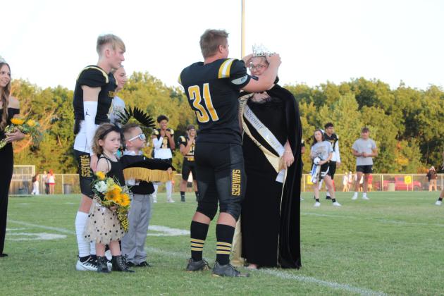 Tecumseh Homecoming Queen Ella Whitney is crowned by senior Hunter Hadsall during the THS Football Homecoming on Sept. 16. Also shown are flower girl Annie Raper, 5, and crown bearer Lincoln Forrester, 4, with senior Parker Williams. Countywide &amp; Sun/Natasha Dunagan