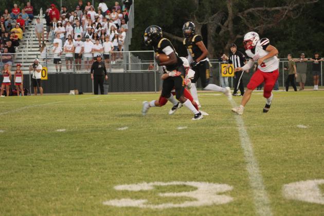 Tecumseh sophomore Shaun Hill carries the ball for a first down and 10 and a gain of 30 yards during the Homecoming game against McLoud on Sept. 16. The Tecumseh Savages won 40-14. Countywide &amp; Sun/Natasha Dunagan
