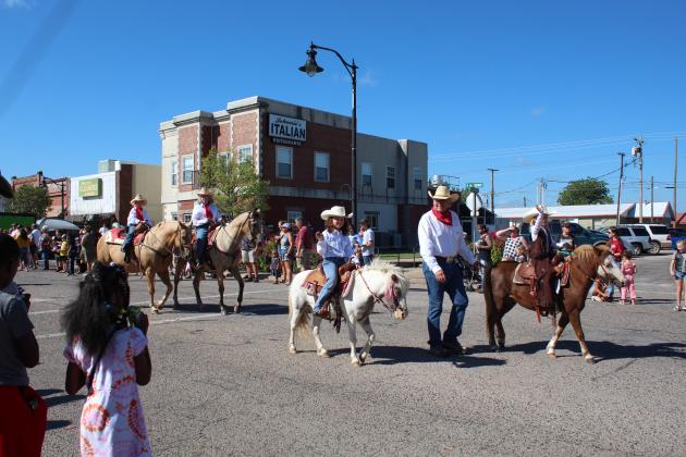 Children and adults ride horses at the end of Tecumseh's Frontier Days Parade on Sept. 17. Countywide &amp; Sun/Natasha Dunagan