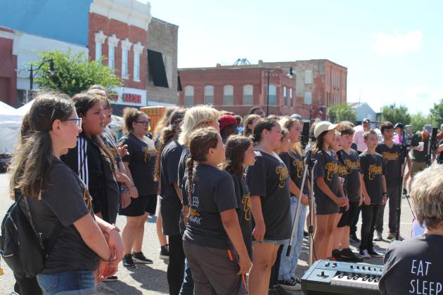The Tecumseh Middle School Choir performs in front of Tecumseh City Hall for Frontier Days on Sept. 17.  Countywide &amp; Sun/Natasha Dunagan
