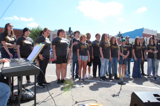The Tecumseh High School Choir performs in front of Tecumseh City Hall for Frontier Days on Sept. 17. Countywide &amp; Sun/Natasha Dunagan
