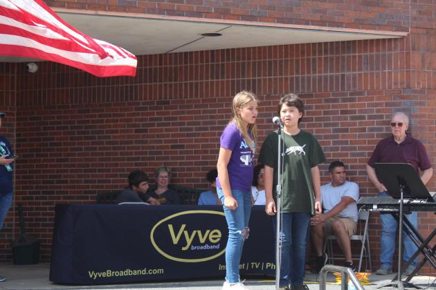 Silver Arts Academy members Riley Chamblin and Hugh Loftis sing "A Whole New World" from the movie "Aladdin" during Frontier Days on Sept. 17. Countywide &amp; Sun/Natasha Dunagan