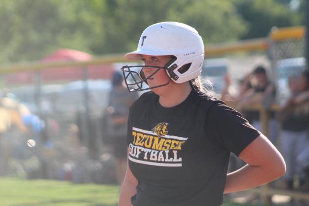 Tecumseh's Samantha Schweighardt rubs her back after being hit by a pitch at bat during the home game against McLoud on Sept. 19. Countywide &amp; Sun/Natasha Dunagan