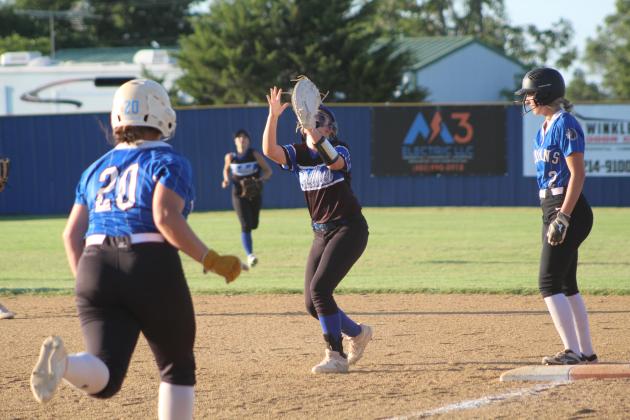 Bethel's Payton Epperley waits to catch the ball as a Little Axe batter nears first base during the first inning of the home game against Little Axe on Sept. 19. The Wildcats won 11-10. Countywide &amp; Sun/Natasha Dunagan
