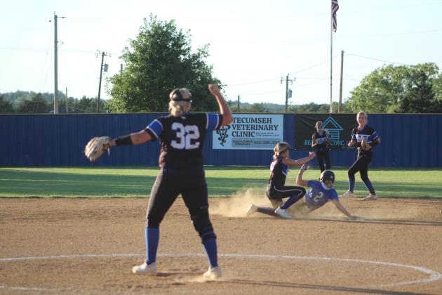 A Little Axe runner slides into second base after Bethel pitcher Annie Compton threw the ball to second baseman Brooklyn Duff for the tag during the first inning of the home game against Little Axe on Sept. 19. The Wildcats won 11-10. Countywide &amp; Sun/Natasha Dunagan