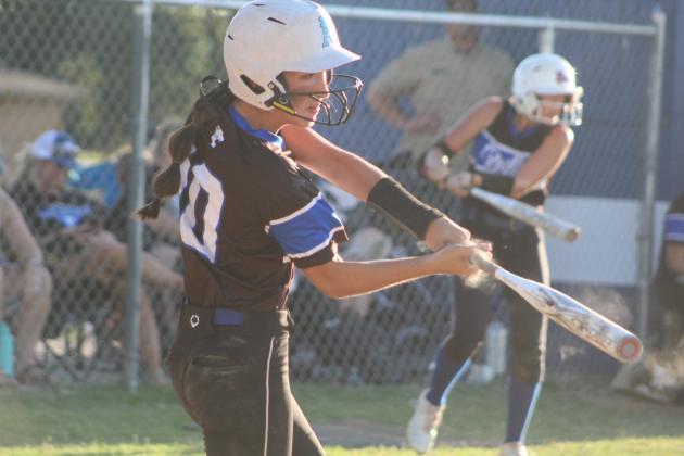 Bethel's Layla Menhusen hits a single during the first inning of the home game against Little Axe on Sept. 19. The Wildcats won 11-10. Countywide &amp; Sun/Natasha Dunagan