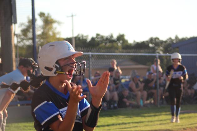 Layla Menhusen celebrates after running home.