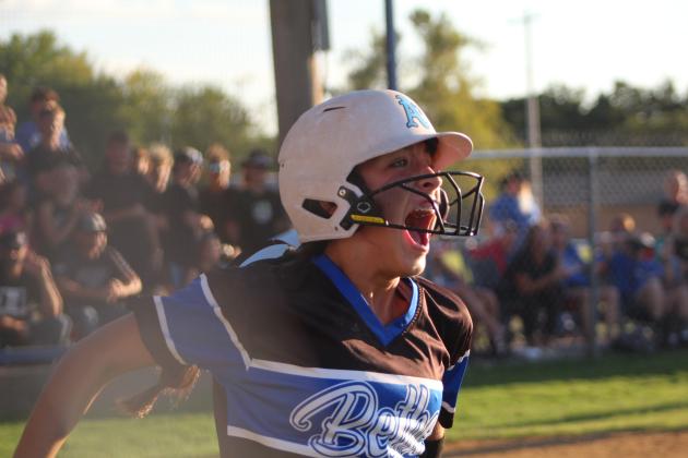 Layla Menhusen celebrates after running home.