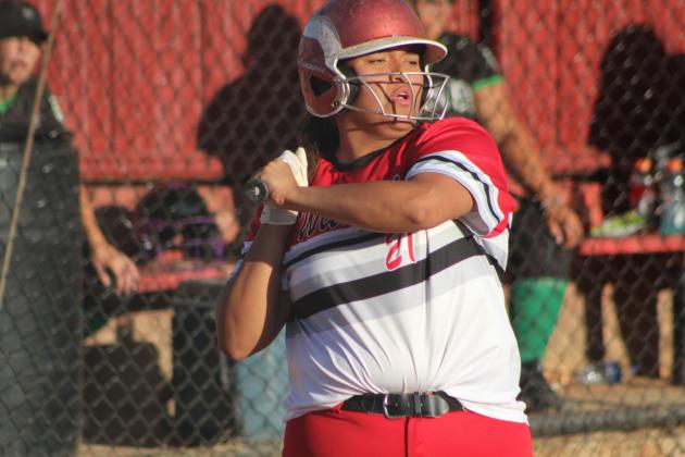 Earlsboro senior Mariana Siqueiros dodges a pitch while at bat during the home game against Varnum on Sept. 20. The Lady Wildcats fastpitch and the cross country team also held their Senior Night ceremonies before the game. Countywide &amp; Sun/Natasha Dunagan