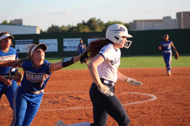 Shawnee's Katelyn Blomquist runs for first base as a Glenpool player tries to tag her during the eighth inning of the district home game on Sept. 20. The Lady Wolves lost, 1-2, in extra innings. Countywide &amp; Sun/Natasha Dunagan