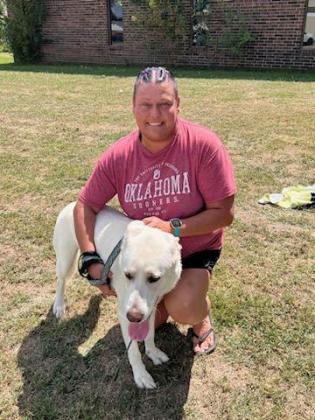 Camden Sparks poses with Jack, who won "Cutest Chonk" in the Frontier Days Pet Contest on Sept. 17. Each winner received a "good boy" bag of toys and grooming items plus a $10 gift certificate to Tecumseh Vet Clinic. Photo provided by Caitlyn Mertz of Tecumseh Vet Clinic.