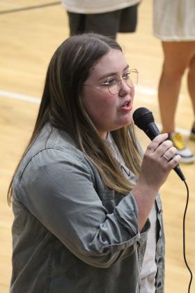 Dusti Ozment sings the National Anthem.