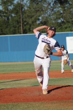 Asher junior Bryce Lamb winds up for the pitch in the home game with Dale on Sept. 26. Dale won, 12-0. Countywide &amp; Sun/Natasha Dunagan