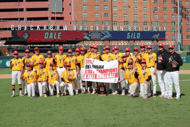 The Dale Pirates Fall Baseball Team and coaches pose with their banner, trophy and medals after winning the Class A State Championship against Silo on Oct. 8. Countywide &amp; Sun/Natasha Dunagan