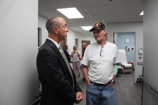 OKC VA Healthcare Systems Director Wade Vlosich, left, talks with Vietnam Veteran Vernon Hoskins, of Shawnee, during the Shawnee VA Clinic Grand Opening on Oct. 21. Countywide &amp; Sun/Natasha Dunagan