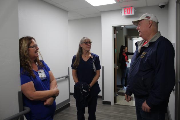 Glenn Harris, of McLoud, who served in the Navy for 24 years, talks with LPN Becky Vanworth and RN Tamara Cummings during the Shawnee VA Clinic Grand Opening on Oct. 21. Countywide &amp; Sun/Natasha Dunagan