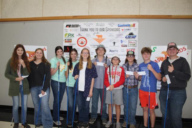 The top 10 winners of the inaugural Beef Quiz Bowl pose with their checks and guide sticks on Oct. 22 at the THS Alumni Center. Shown, from left, are Callin Smith, Schuyler Hill, Rylee Williams, Jocelyn Phelps, Chloe Hill, Stephen Wickerd, Jet Smith, Sawyer Speers, Taylor Marrs and Logan Matlock. Countywide &amp; Sun/Natasha Dunagan