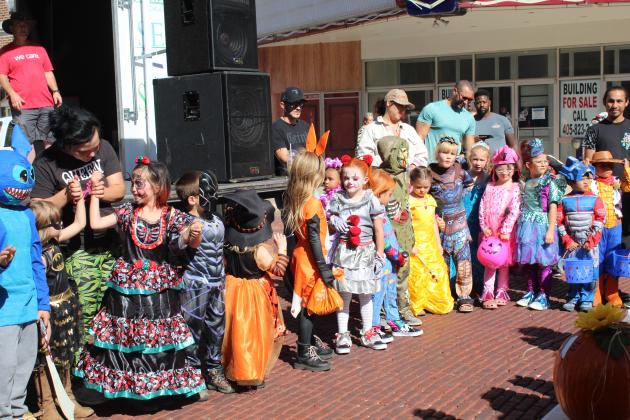 Contestants in the 4-7-year costume contest wait for the judges' decision during Monsters on Main in downtown Shawnee, Oct. 22. Third from left, Raelynn Davis, 7, of Meeker, placed second, and eighth from left, Tinley Dobson, 7, of Seminole, as Pennywise, placed first. Countywide &amp; Sun/Natasha Dunagan