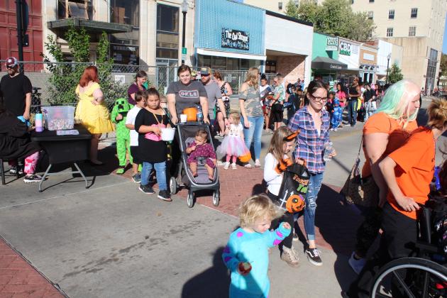 Hundreds of children and their family members line Main Street in Shawnee to trick-or-treat at downtown businesses during Monsters on Main, Oct. 22. The event, organized by Community Renewal this year, also featured a pet contest and costume contest. Countywide &amp; Sun/Natasha Dunagan