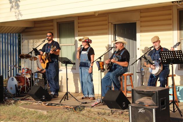 The Pott. County Pickers, of Romulus Baptist Church, perform during Macomb Trade Days on Sept. 23. They are Bryce Reich, on drums; Andy Reich, on vocals and guitar; Angela Williams, on vocals; Steve Arney, on guitar, mandolin, and vocals; and Chris Daniels, on banjo and vocals.