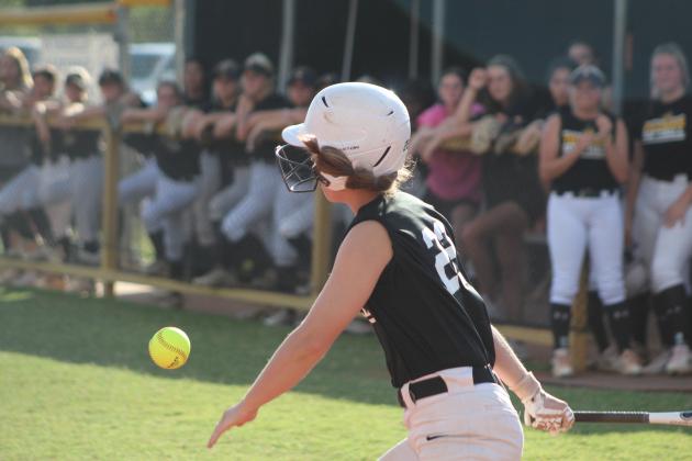 Tecumseh's Jessi Hull hits a sacrifice fly in the third inning of the home game against McLoud on Sept. 19. The Lady Savages won 12-0. Countywide &amp; Sun/Natasha Dunagan