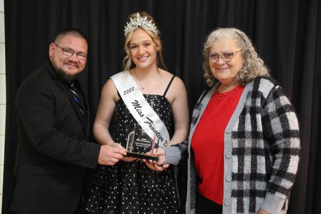 IPC (Interpersonal Communications) Daniel Castaneda, left, and Department Director Carol Miller, right, accept the New Construction Award for the Central Oklahoma Juvenile Center from Miss Frontier Days Sadie Boatman during the Tecumseh Chamber of Commerce Annual Meeting and Business Awards Banquet on Nov. 14. Countywide &amp; Sun/Natasha Dunagan