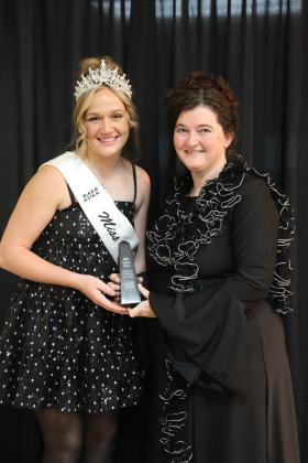 Miss Frontier Days Sadie Boatman presents the Legacy Award to Tecumseh Public Library Director Beth Lyle for the Pioneer Library Systems during the Tecumseh Chamber of Commerce Annual Meeting and Business Awards Banquet on Nov. 14. Countywide &amp; Sun/Natasha Dunagan