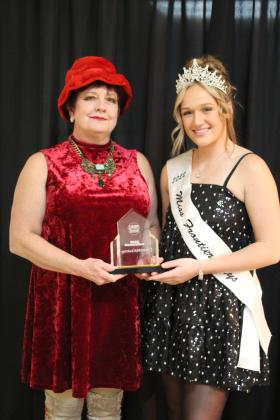 SpOKeLAHOMA co-owner Fran Topping accepts the Renovation of the Year Award from Miss Frontier Days Sadie Boatman during the Tecumseh Chamber of Commerce Annual Meeting and Business Awards Banquet on Nov. 14 in the City Hall Auditorium. Countywide &amp; Sun/Natasha Dunagan