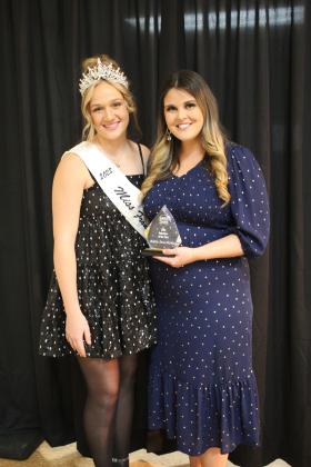 Katie McMahan accepts the Volunteer of the Year Award from Miss Frontier Days Sadie Boatman during the Tecumseh Chamber of Commerce Annual Meeting and Business Awards Banquet on Nov. 14 in the City Hall Auditorium. McMahan organized the Frontier Days Pageant this year. Countywide &amp; Sun/Natasha Dunagan