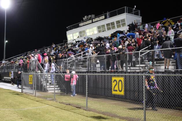 Tecumseh's students and fans were bundled up and waterproofed for the rainy Pink Out home game against Bridge Creek on Oct. 28. Countywide &amp; Sun/Natasha Dunagan